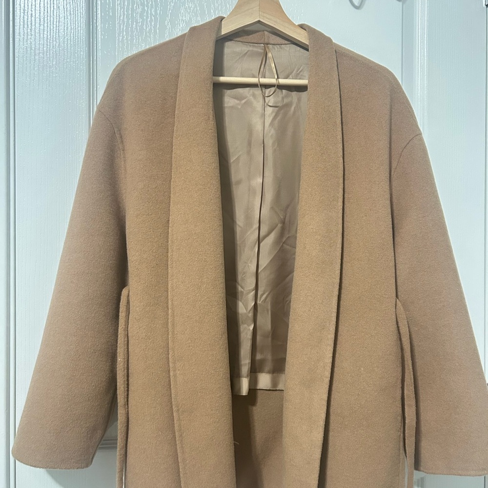 Tan oversized cape with shawl lapels and mid-length design